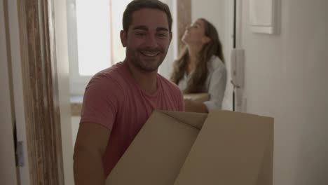 Happy-Caucasian-couple-coming-into-new-house-or-apartment-for-the-first-time