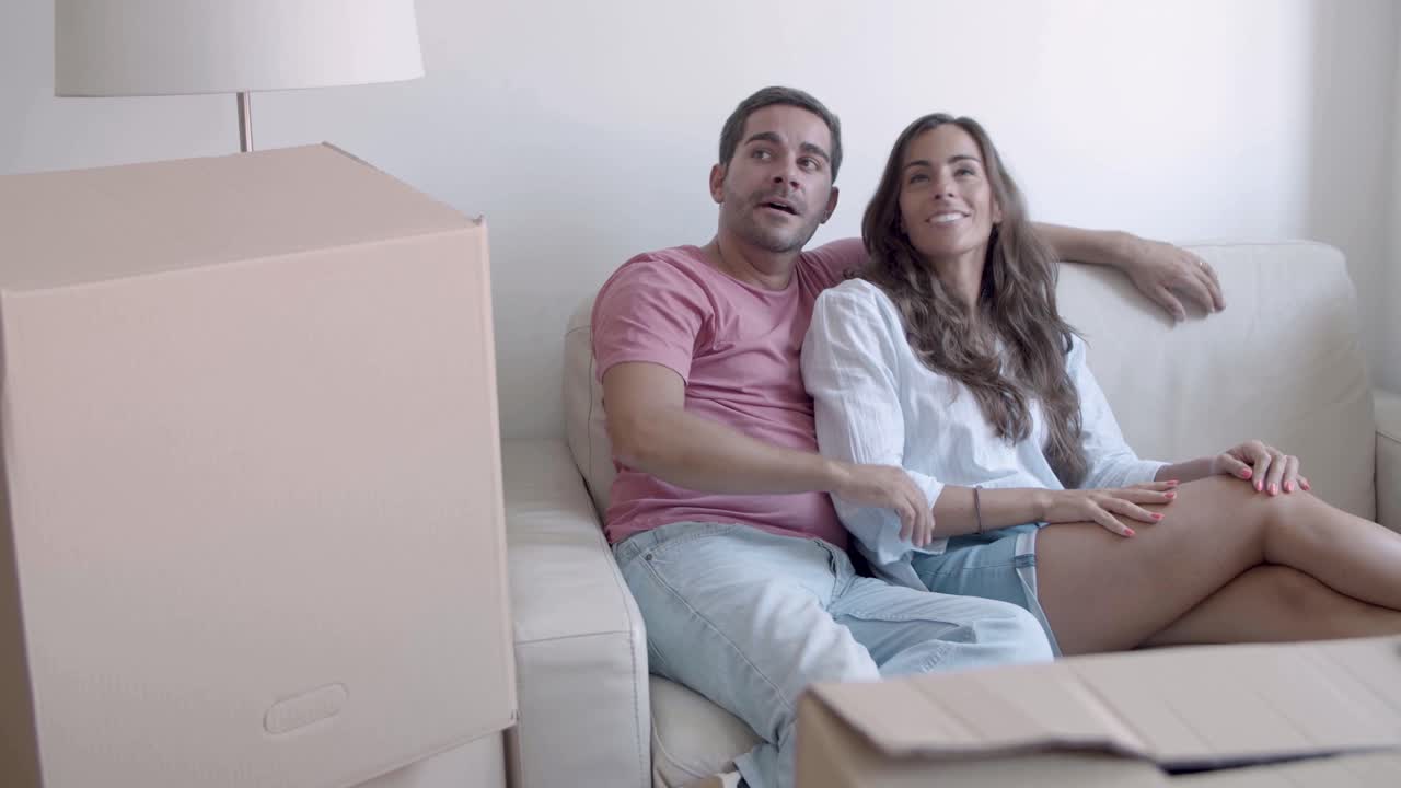 Free Stock Video - Happy Caucasian Couple Sitting On Sofa, Talking And ...