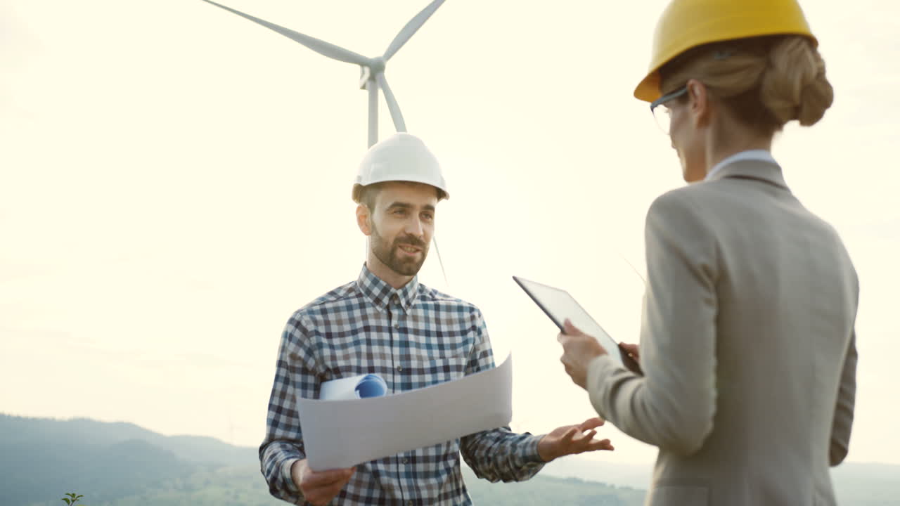 Free stock video - Caucasian male engineer wearing a helmet holding ...