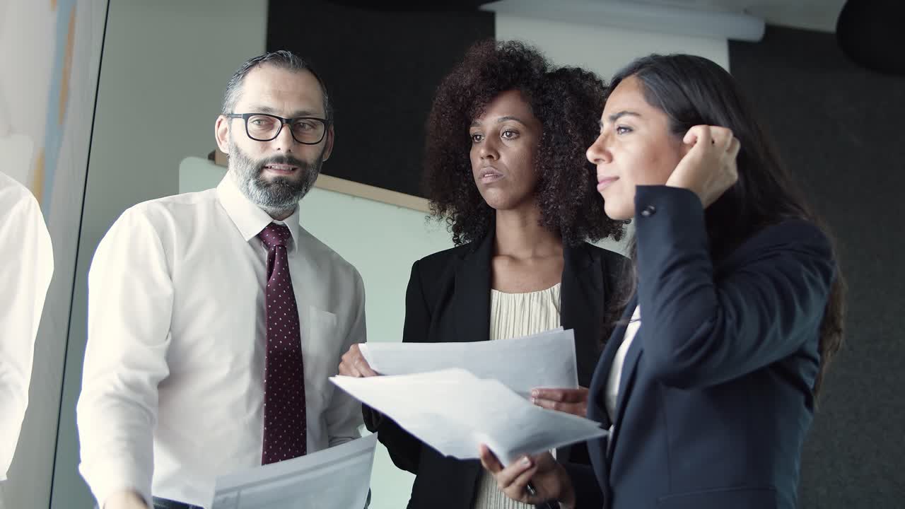 Free stock video - Three business partners discussing company marketing ...