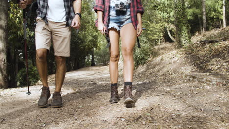 Legs-of-hikers-wearing-shorts-and-trekking-boot