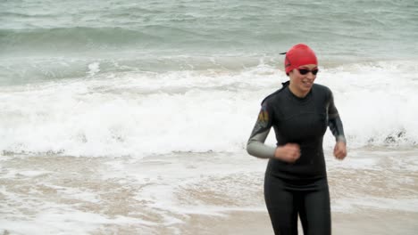 Happy-sportswoman-in-sea-waves