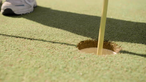 Closeup-golf-ball-getting-inside-hole