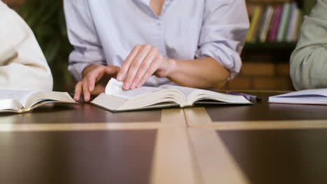 Closeup-teacher-reading-the-Bible-in-class-with-students