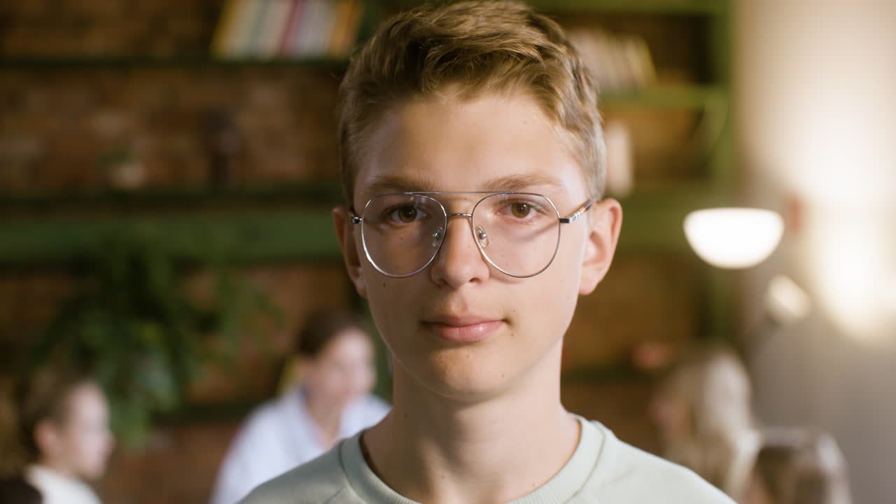 free-stock-video-closeup-of-boy-in-glasses-smiling-in-class