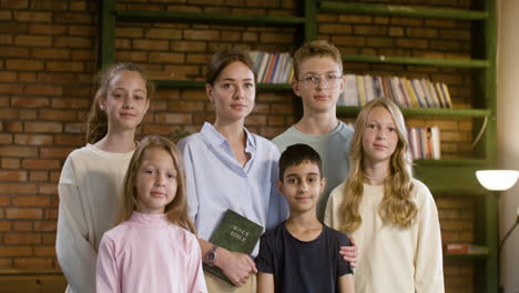 Teacher-and-her-christian-students-posing-at-the-school