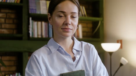 Closeup-of-christian-teacher-holding-the-holy-book-in-her-hands-at-the-school