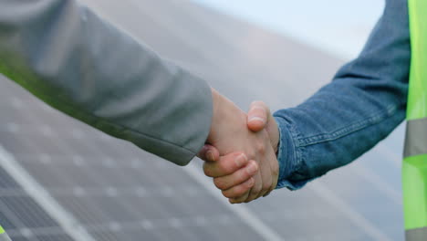 Close-up-view-of-handshake-on-solar-plantation