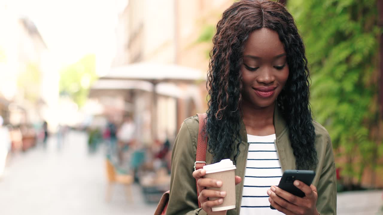 Free stock video - African american woman holding coffee to go and ...