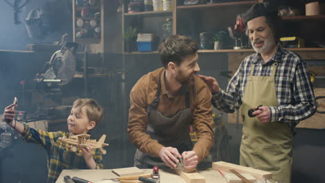 Happy-Caucasian-family-of-carpinters-in-workshop
