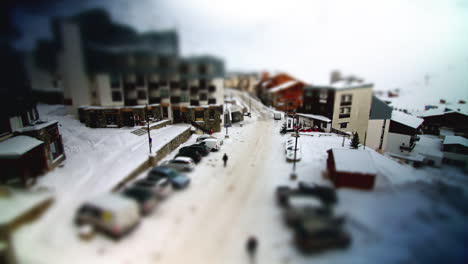 Miniaturisation-style-timelapse-in-French-Ski-resort,-people-and-cars-move-around-below