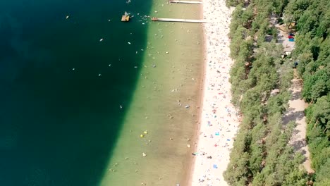 Flying-Over-Crowed-Beach-in-Summer-in-Finland