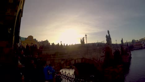 Prague,-pan-over-charles-bridge-and-moldavia-to-the-castle-hradschin-at-sunset