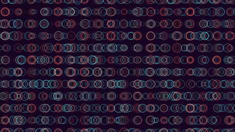 Symmetrical-red-and-blue-circles-in-circular-pattern-on-dark-background