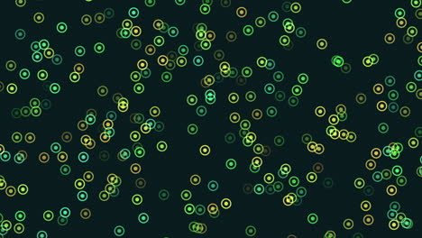 Circular-pattern-of-green-and-yellow-circles-on-black-background