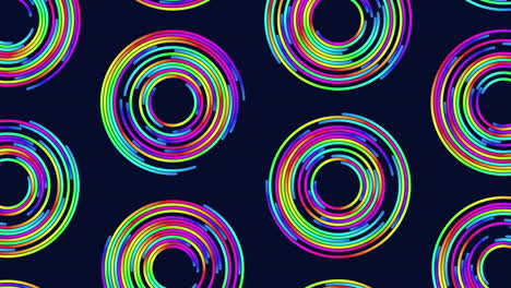 Swirling-rainbow-lines-create-mesmerizing-circular-pattern-on-black-background