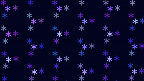 Symmetrical-pattern-of-purple-and-blue-snowflakes-on-black-background