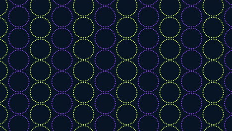 Circular-pattern-of-purple-and-green-circles-on-black-background