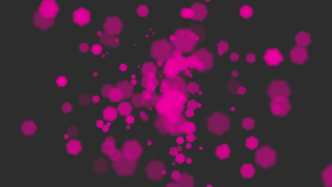 Circular-cluster-of-pink-dots-on-black-background