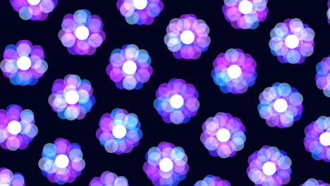 Floating-circular-pattern-of-purple-and-blue-flowers-on-dark-background