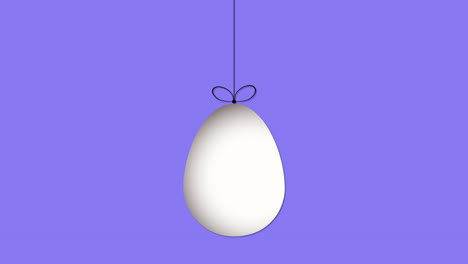 Hanging-egg-on-vibrant-blue-background