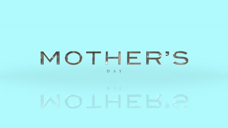 Golden-text-on-light-blue-celebrating-Mothers-Day-logo