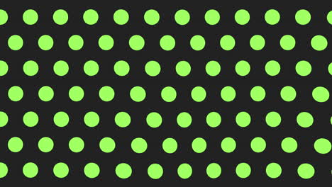 Pattern-of-green-and-black-dots-on-black-background