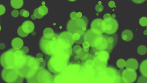 Mesmerizing-circular-motion-blurry-green-dots-on-black-background