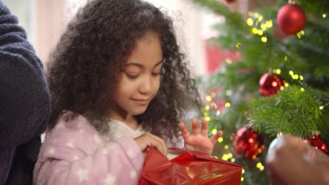 MCU-of-Child-Opening-Christmas-Present