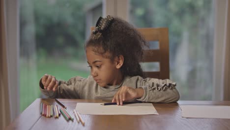 Young-Girl-Choosing-Colored-Pencil