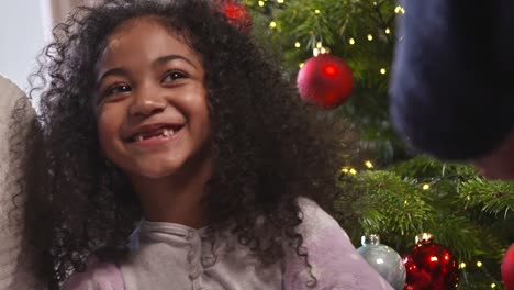 Girl-Smiling-At-Christmas