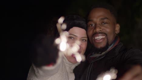 Man-and-Woman-Waving-Sparklers