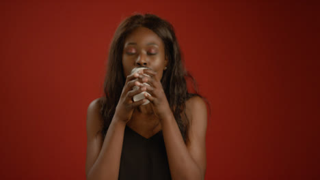 Woman-Takes-a-Big-Drink-from-Cup