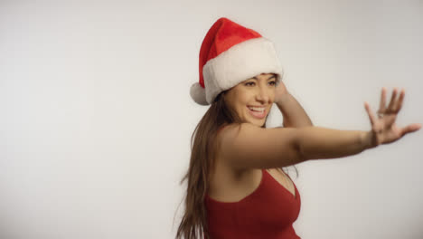 Woman-Wearing-Santa-Hat-Spins-Around