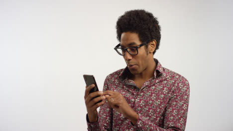 Man-Takes-Out-Phone-Scrolls-and-Reacts