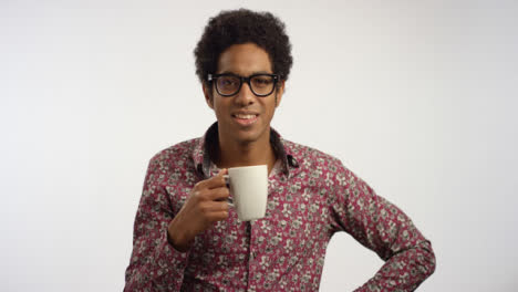 Young-Man-Drinks-Coffee-From-a-Mug