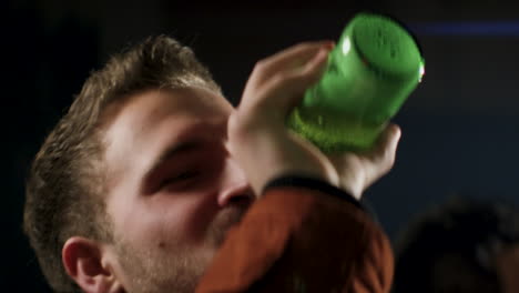 Young-Man-Drinks-Beer-from-Bottle