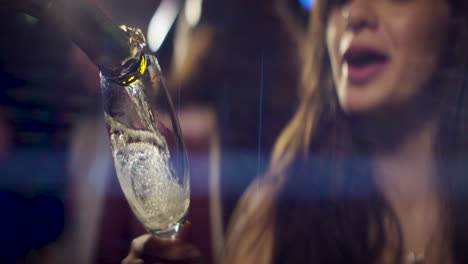 Pouring-champagne-with-happy-woman