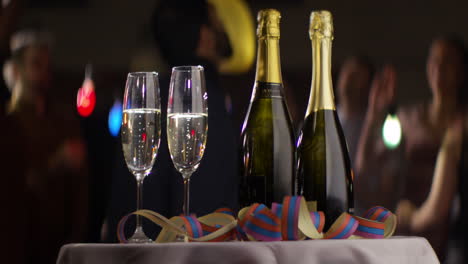 Champagne-Bottles-and-Glasses-On-Table