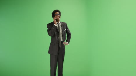 Smiling-Businessman-talking-on-phone-with-green-screen