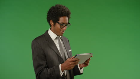 Businessman-Using-Tablet-on-Green-Screen
