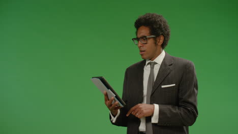 Frustrated-Businessman-Uses-Tablet-on-Green-Screen