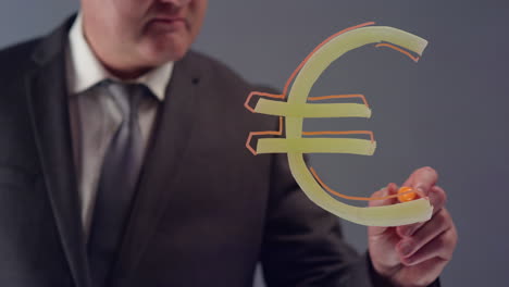Businessman-Drawing-€-Symbol