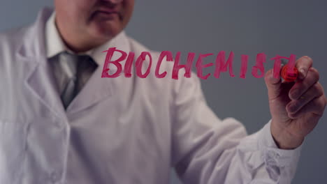 Scientist-Writing-The-Word-Biochemistry