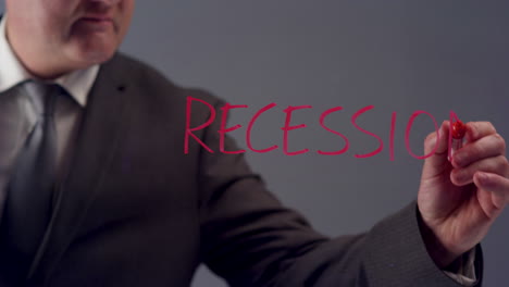 Hombre-de-negocios-Writing-Word-Recession