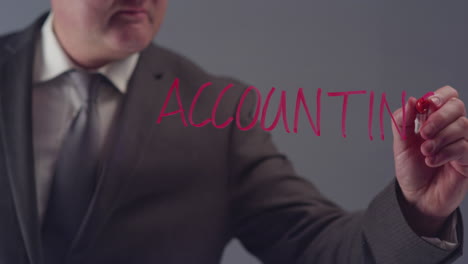 Businessman-Writing-the-Word-Accounting