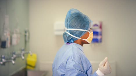 Medical-Staff-Putting-On-Surgical-Mask
