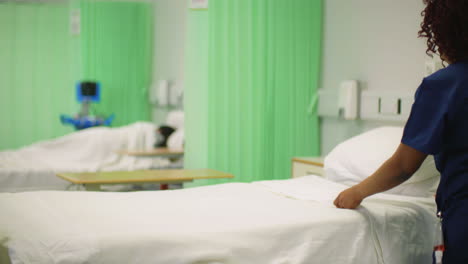 Nurse-Making-Hospital-Ward-Bed