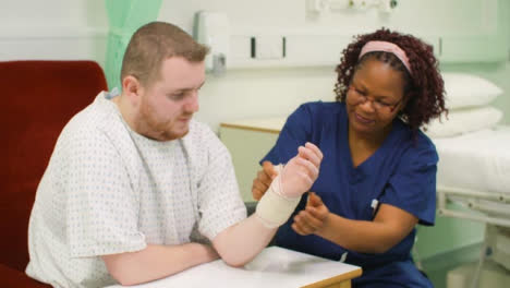 Nurse-Bandaging-Patients-Injured-Wrist