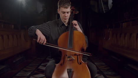 Front-View-Male-Cellist-Playing-During-Rehearsal